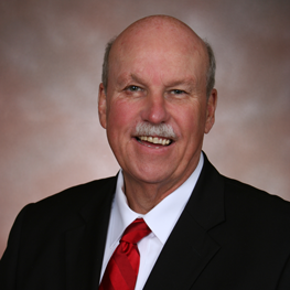 A man wearing a suit and tie
