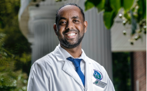 male professional in white lab coat