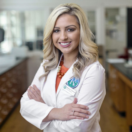 female student in lab coat head shot