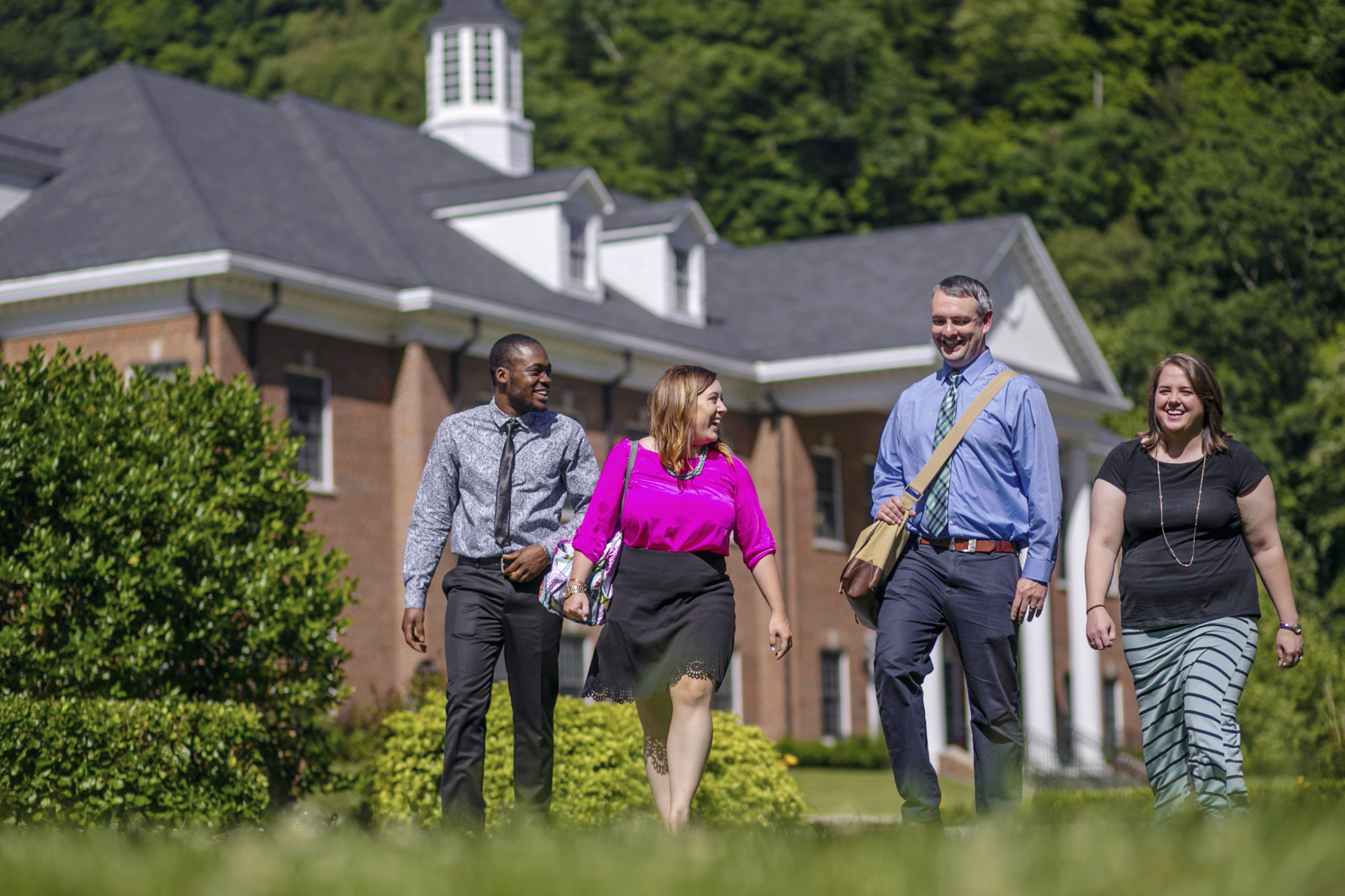 students and faculty walking on campus