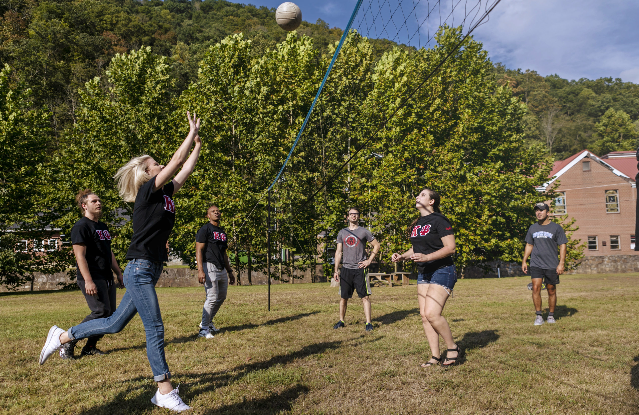 students playing volleyball